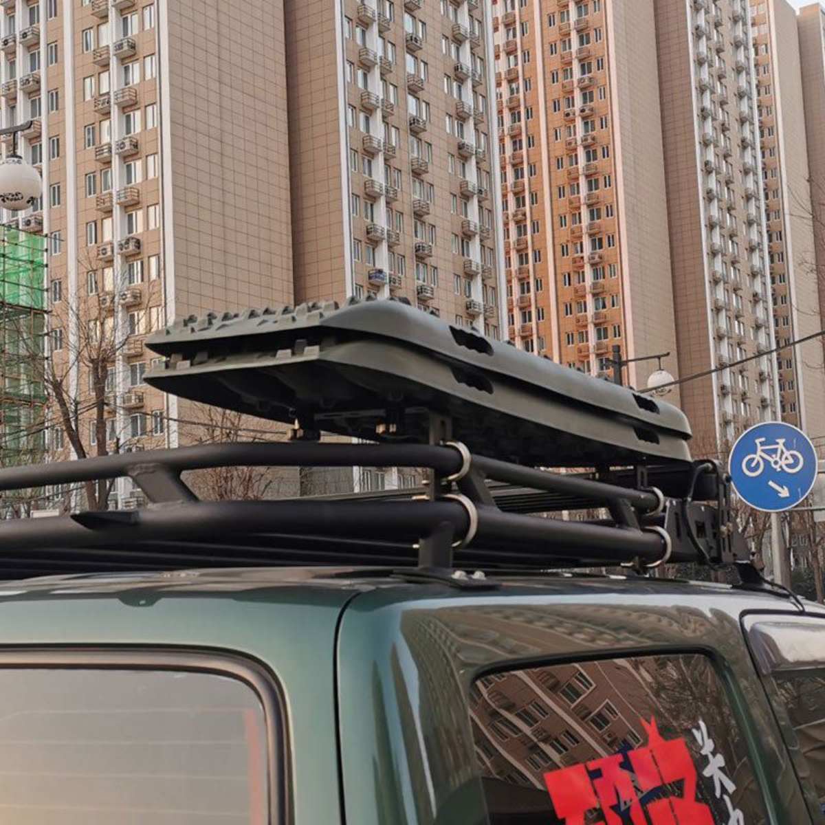 Pro-grade traction boards mounted on SUV roof rack for off-road use