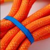 Close-up view of heavy duty orange braided tow strap for 4x4 recovery