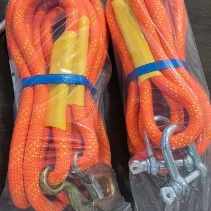 Pair of heavy duty orange tow straps packed with shackles for car recovery