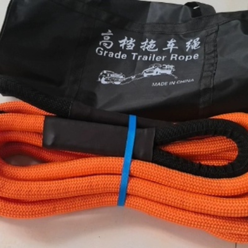Heavy duty orange tow strap with black storage bag for vehicle towing